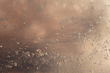 Dirty water contaminated with crude oil that drained into the public water supply, close-up at the water surface. Industrial problem and environmental impact issue, background.