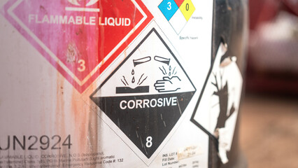 Acidity corrosion or skin burn hazard, safety sign on the chemical containment barrel. Sign and...
