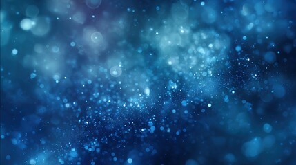 Obraz premium Abstract blue background with bokeh effect and bright particles floating