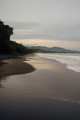 Reflections on the Black Sand Shore of Playa Negra, Puerto Viejo