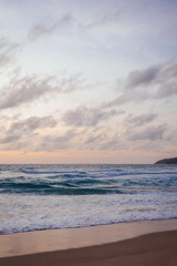 Fototapeta premium Soft Pastel Evening Over Waves at Karon Beach, Phuket, Thailand
