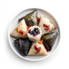 Plate of  steamed rice dumplings, various fillings, and  leaves