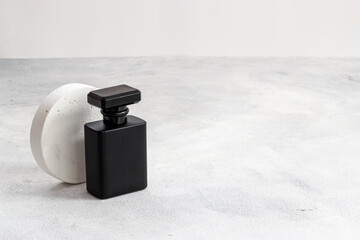 Black man perfume bottle close up. Male fragrance concept