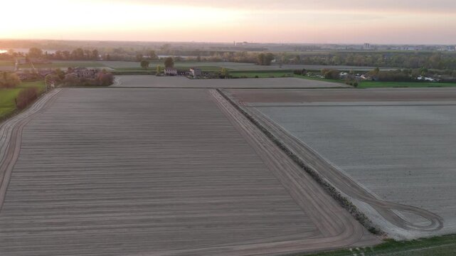 Bare soil ready for planting. The pattern and scale indicate large-scale commercial crop farming typical of northern Italy&rsquo;s Po Valley agricultural landscape