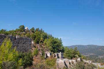 Fethiye Kayak&ouml;y stone houses and ruins. Mugla, Turkey. Kayakoy ghost village. Turkey's abandoned houses. The Ghost Town of Kayakoy. Abandoned religious ghost city.