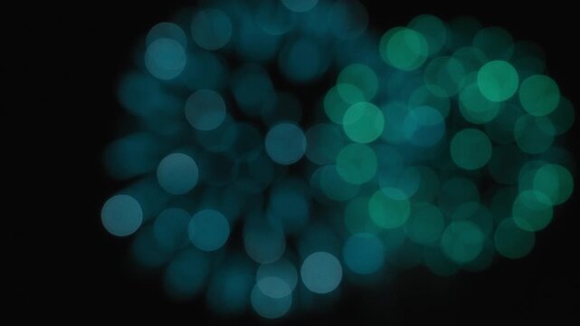 Abstract colorful bokeh lights of fireworks exploding on the night sky