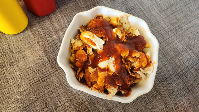 Kova D&ouml;ner (literally means bucket or bowl doner) is the ultimate experience: sliced chicken d&ouml;ner kebab served in a bowl, generously topped with crispy fries and a cascade of signature sauces