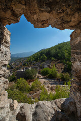 Fethiye Kayaköy stone houses and ruins. Mugla, Turkey. Kayakoy ghost village. Turkey's abandoned houses. The Ghost Town of Kayakoy. Abandoned religious ghost city.