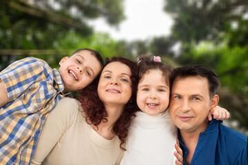 Happy young family walking in the park