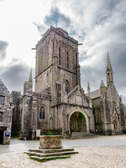 View of the Sant Ronan church in the antique village of Locronan in Brittany, France