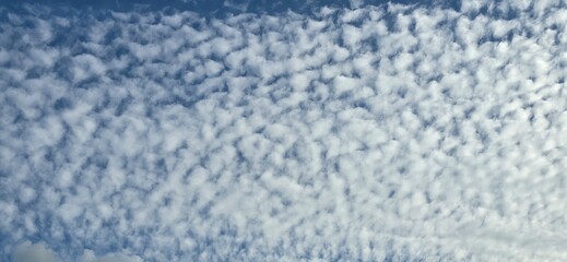 Blue sky covered with white clouds