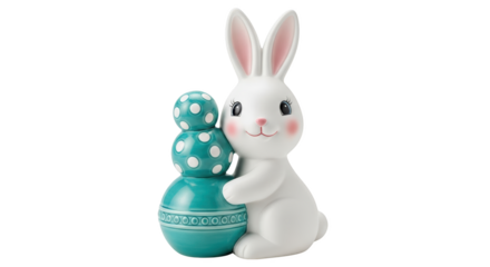 White ceramic Easter bunny character holding stacked turquoise polka dot eggs isolate rabbit figurine decoration cute toy spring celebration holiday festive