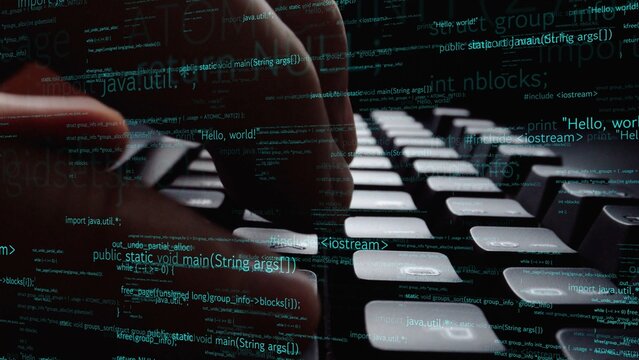 Close-up view of fingers typing on a standard keyboard with streaming lines of code in the background. Ideal for technology, programming, and digital innovation themes. Xenic
