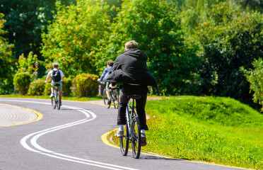 Cyclist ride on the bike path in the city Park
