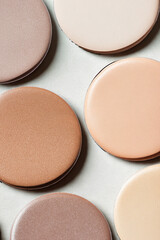 Close up of makeup palette with various shades of foundation and blush