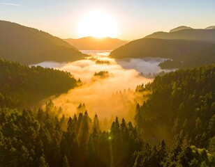 Aerial view of a mountain valley filled with low-lying clouds at dawn