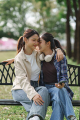 Young asian women sharing intimate affectionate moment