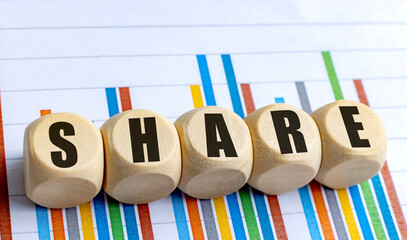 SHARE word on wooden round blocks with colorful bar chart background