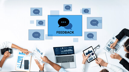 Fototapeta premium Engaging teams in a modern office setup, showcasing feedback through digital devices. Ideal for conveying collaboration, communication, and productivity themes. Trope