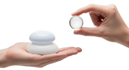 Hand holding a clear glass sphere above a stack of two white cosmetic suction cups on another palm Crystal Round Object Isolate Transparent Background transparent background