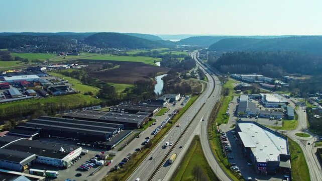 E20 highway leading out from Gothenburg area, Sweden under clear skies
