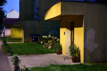 Sailboat on calm ocean horizon during golden sunset, serene seascape, two distant vessels, peaceful maritime scene