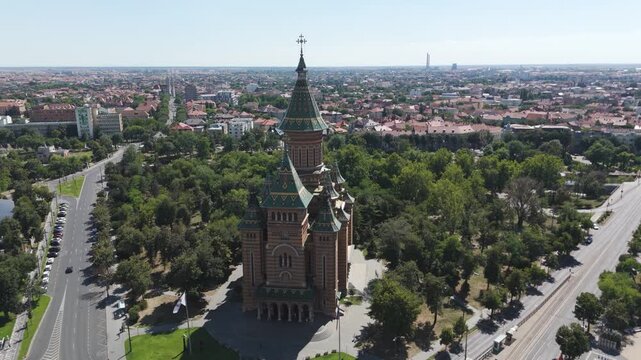 Scenic drone orbit of Timisoara&rsquo;s Metropolitan Cathedral, showcasing facade details and landmark features.