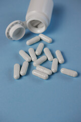 Capsules scattered on the surface. The concept of modern pharmacology.
