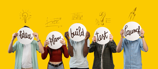 Diverse group of young people holding signs illustrating the startup process