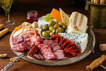 Meat and cheese board. A mix of exquisite cheeses and cold cuts from many countries.