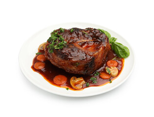 Tasty beef ossobuco with carrot, mushrooms and herbs isolated on white