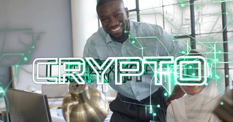 Colleagues leaning over desk viewing neon crypto overlay in office with laptop and documents