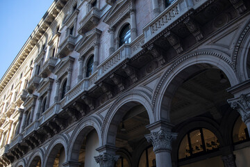 Historic Ornate Archway and Balconies of Milanese Architecture.