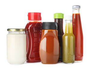 Bottles with different tasty sauces isolated on white