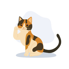 a cute calico cat raising one paw. sitting calico cat.  japanese maneki neko waving paw