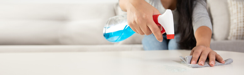 A woman cleaning the table