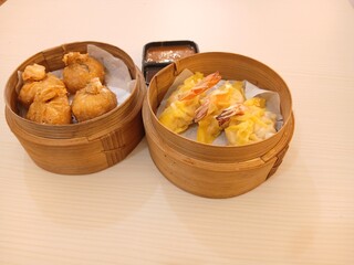 dim sum dumpling on bamboo wooden basket bowl