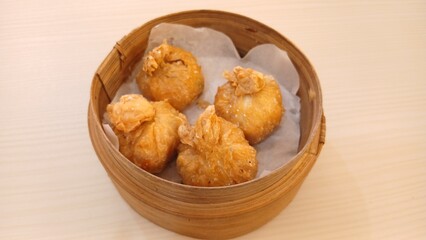 dim sum dumpling on bamboo wooden basket bowl