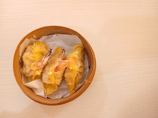 dim sum dumpling on bamboo wooden basket bowl