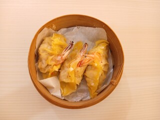 dim sum dumpling on bamboo wooden basket bowl