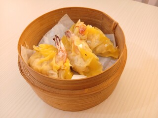 dim sum dumpling on bamboo wooden basket bowl