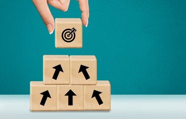 The image of target and arrows on wooden cubes