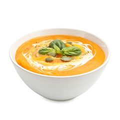 Delicious pumpkin cream soup with basil and seeds isolated on white