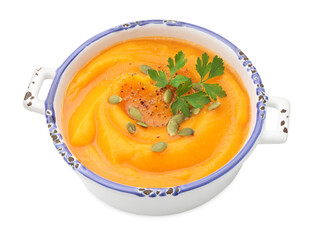 Delicious pumpkin cream soup with parsley and seeds isolated on white