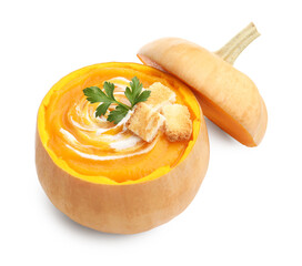 Tasty pumpkin cream soup with croutons and parsley in pumpkin isolated on white