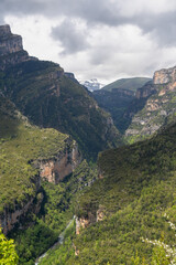 Obraz premium tree lined rock outrcrops and glacial formations, gorges and canyons in mountains, Spain