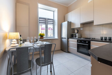 Bright Modern Kitchen with Dining Table and Window View