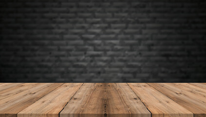 Rustic wooden table in front of a textured black wall