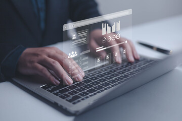 Businessman using laptop with virtual data dashboard and analytics interface. Concept of digital technology, big data analysis, and business intelligence for modern corporate management.