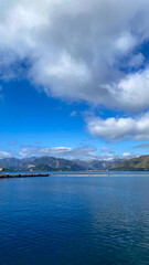 A large body of water with mountains in the background